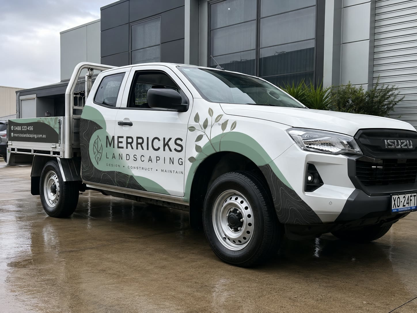 Landscaper's ute in a full colour wrap, three-quarter front